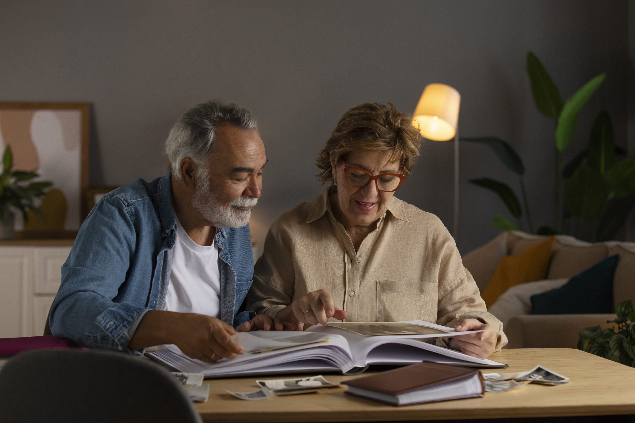 Old couple looking at picture album